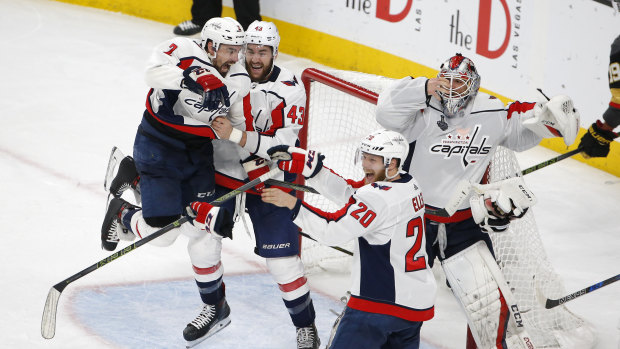 Their year: Capitals players celebrate after winning game five, and the series.