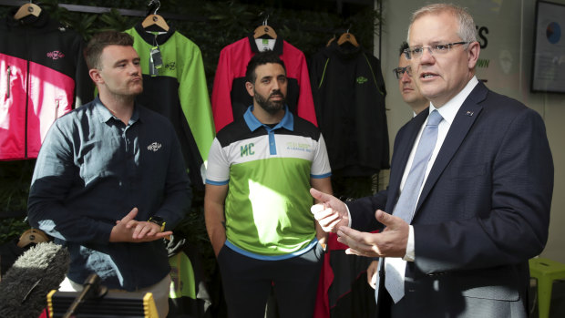 Canberra bid leader Michael Caggiano (middle) with Prime Minister Scott Morrison.