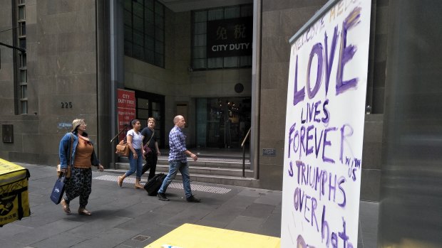 A defiant banner outside City Duty Free, near the scene of Friday afternoon's attack.