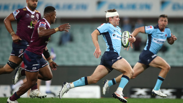 Will Harrison of the Waratahs  breaks through the defense during the round six Super Rugby AU match between the Waratahs and the Reds at Sydney Cricket Ground on August 08, 2020 in Sydney, Australia.