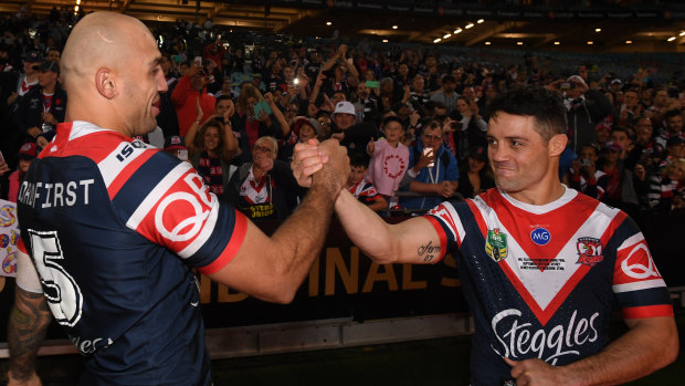 Common thread: Roosters teammates Blake Ferguson (left) and Cooper Cronk following the triumph over Melbourne.