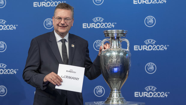 Hosts: German football president Reinhard Grindel poses after UEFA announced his nation would host Euro 2024.