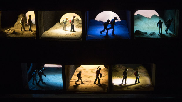 A series of the dioramas which light up one by one to tell the story (shown here all lit up together).