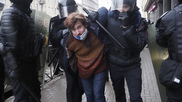 Police detain a protester during a protest against the jailing of opposition leader Alexei Navalny in St Petersburg.