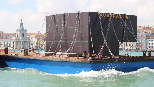 In Richard Bell's disruption, a model of the Australian pavilion at the Venice Biennale is chained on a barge. 