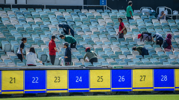 The cleaners put the finishing touches on at Canberra Stadium on Thursday.