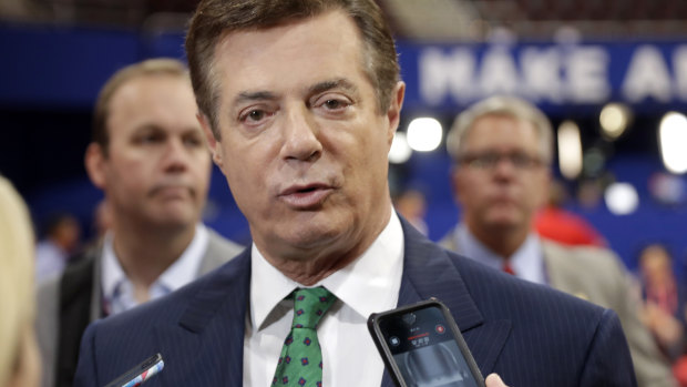 Then-Trump campaign chairman Paul Manafort talks to reporters on the floor of the Republican National Convention in 2016.