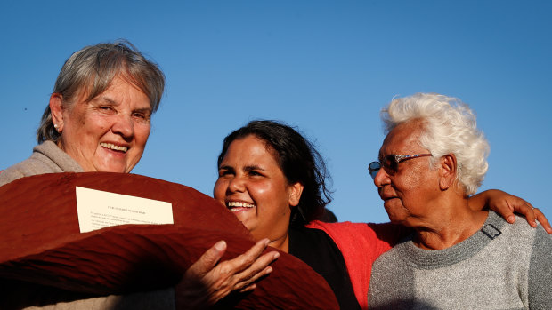 Pat Anderson (left), Sally Scales and Irene Davey in May 2017 holding a piti with the Uluru Statement from the Heart.