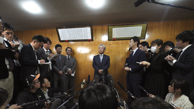 International Olympics Committee member and head of the Japanese Olympic Committee Tsunekazu Takeda, centre, speaks to journalists after a JOC executive board meeting in Tokyo on Tuesday. 