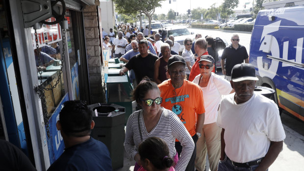 People line up to buy lottery tickets outside of a liquor store in Hawthorne, California.