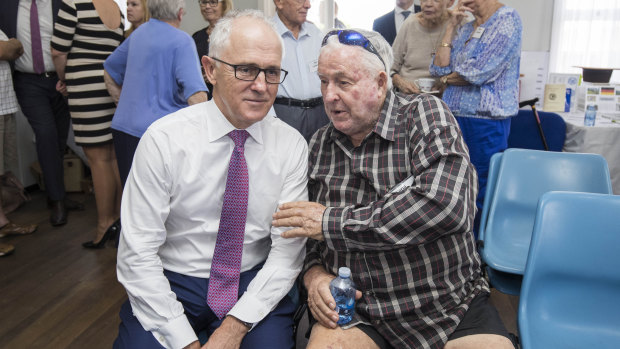 Take my advice, mate: Malcolm Turnbull and local Norm Clarke at a community lunch in Brisbane.