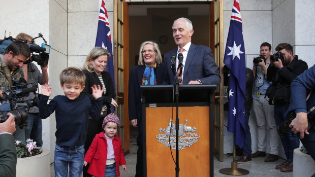 Malcolm Turnbull, pictured with his family, speaks to the media after his party room loss on Friday.