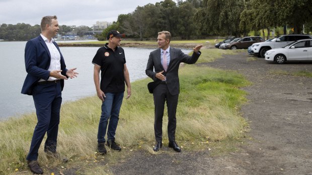 Greens MP for Balmain Jamie Parker, left, Balmain and District Football Club president Paul Avery and NSW Planning Minister Rob Stokes check out the waterfront area set for an upgrade.