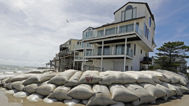 Sand bags surround homes on North Topsail Beach, NC.