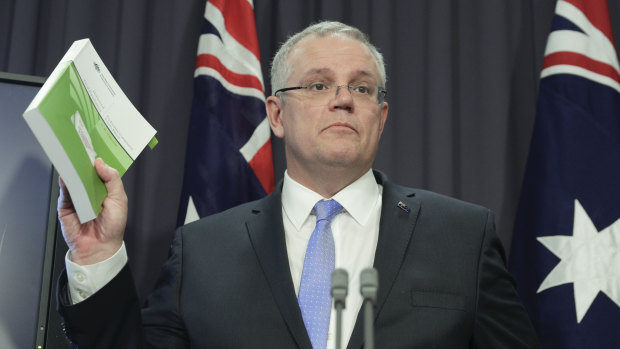 The Treasurer explains his new GST system at a press conference in Canberra on Thursday.
