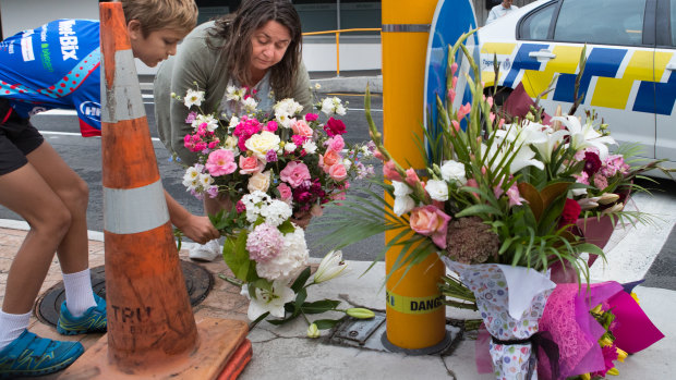 Locals lay flowers at the Masjid Al Noor Mosque in Christchurch.