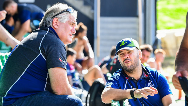 Scott Johnson (left) and Michael Cheika chat during a Wallabies training session in July. 