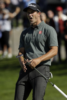 Adam Scott reacts as his second-hole putt for birdie just misses.