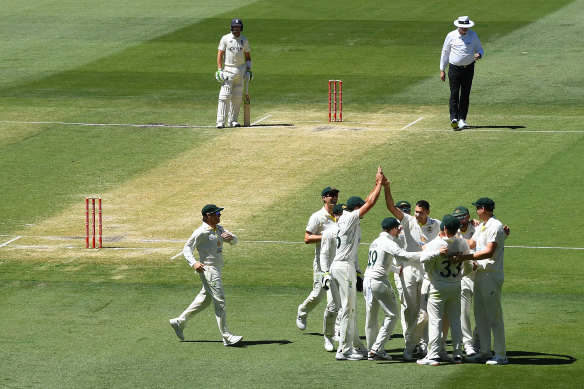 Scott Boland of Australia celebrates after dismissing Joe Root.