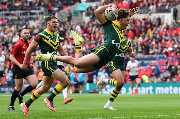 Reece Walsh performs the swan dive as he crossed for the first of two tries at Wembley Stadium. 