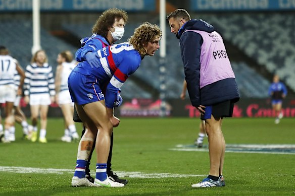 Medical staff attend to Aaron Naughton.