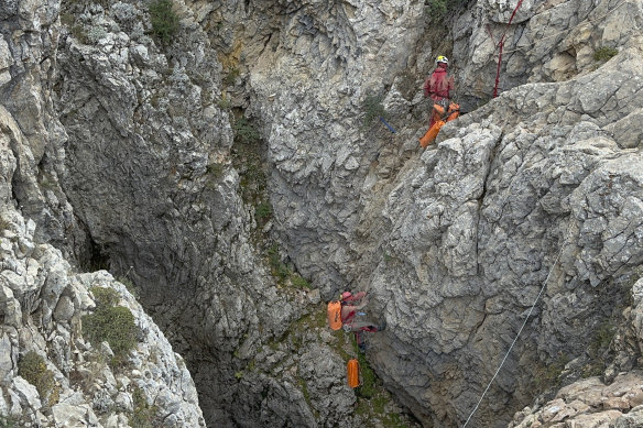 European Cave Rescue Association (ECRA) members work next to the entrance of Morca cave near Anamur, southern Turkey.