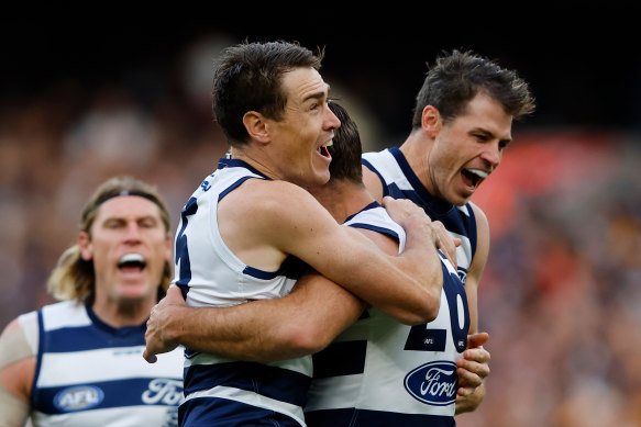 Geelong celebrate a goal against Hawthorn on Easter Sunday.