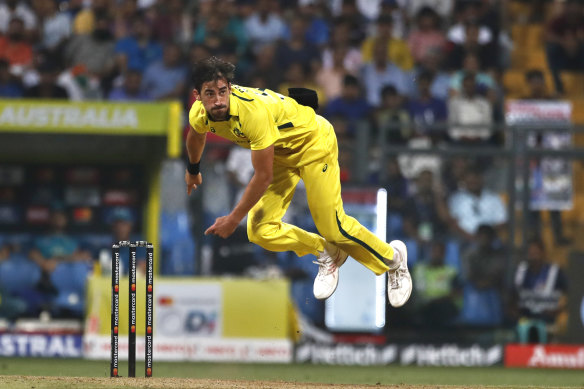 Mitchell Starc bowls during the first game in the One Day International Series between India and Australia.