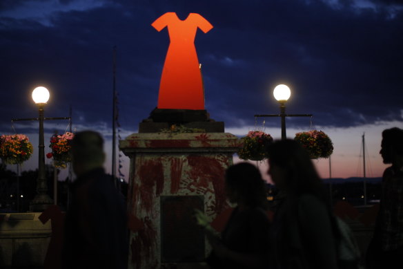 A statue of Captain Cook was removed from its base and replaced with a red dress to symbolise the murder of indigenous women. 