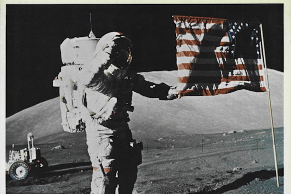 Astro<em></em>naut Eugene A. Cernan, commander of the Apollo 17 lunar landing mission, salutes the US flag.