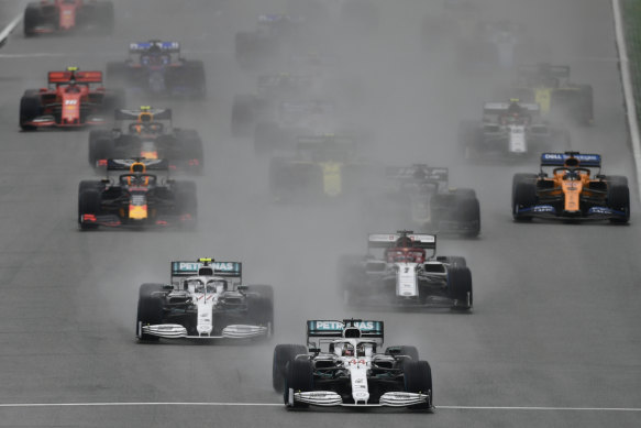 Mercedes driver Lewis Hamilton leads into the first bend at the start of the German Formula One Grand Prix on a rain-soaked track at Hockenheim on Sunday.