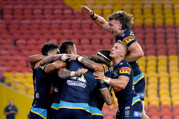 Titans players celebrate after Phillip Sami scored the winning try. 