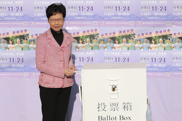 Hong Kong Chief Executive Carrie Lam casts her ballot at a polling place in Hong Kong on Sunday.
