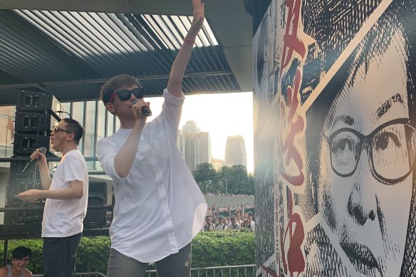 Denise Ho performing during a pro-democracy rally in Hong Kong. Ho has also become a target for pro-China demonstrators after a funeral wreath with her face printed on it was left near a protest wall.