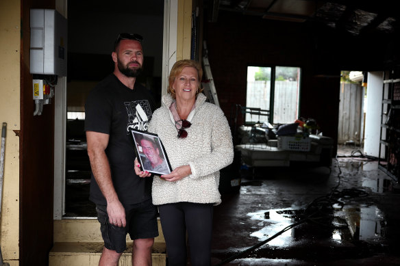Jane Trewin with son Tyson at their home next to the Maribyrnong River two days after the floods.