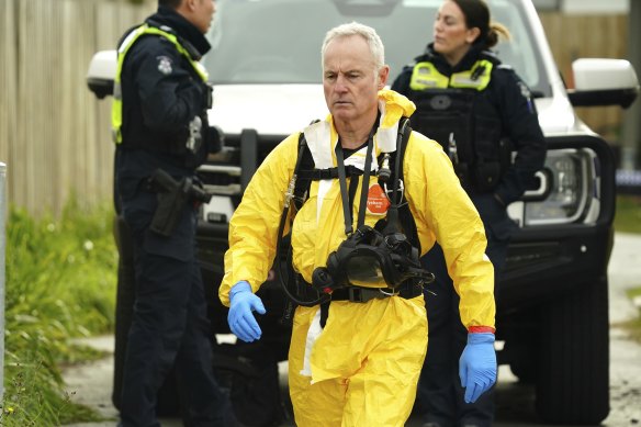 A forensic police officer at the site where the bodies were found on Tuesday.