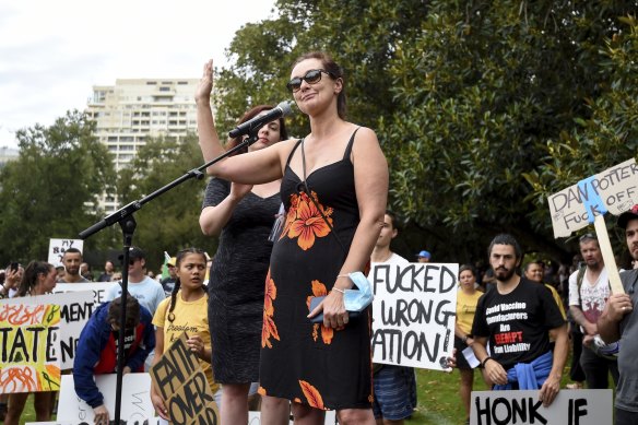 Victorian MP Catherine Cumming tries to speak at a demonstration against vaccination and COVID restrictions at Fawkner Park in February.