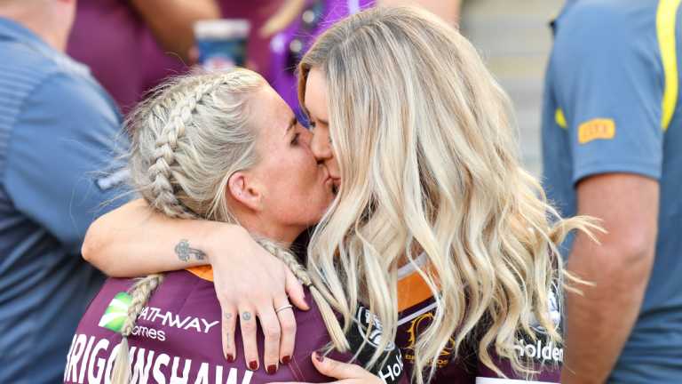 Special moment: Ali Brigginshaw kisses partner Kate Daly. 