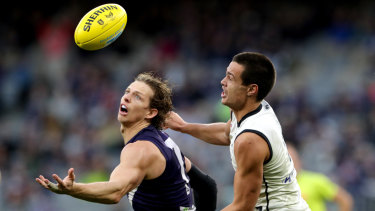 Natty skills: Fremantle's Nat Fyfe looks to mark under pressure from Carlton's Jack Silvagni.