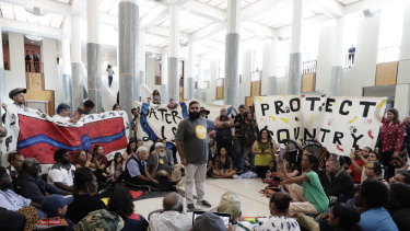 Protestors against fracking in the marble foyer of Parliament House in Canberra.