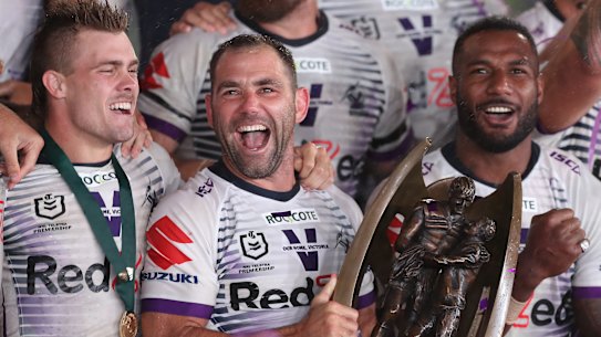 Cameron Smith and the Melbourne Storm with the premiership trophy.