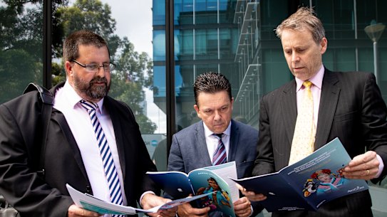 Troy Stolz, Nick Xenaphon and Stephen Mayne outside the Annual General Meeting for Aristocrat Leisure.