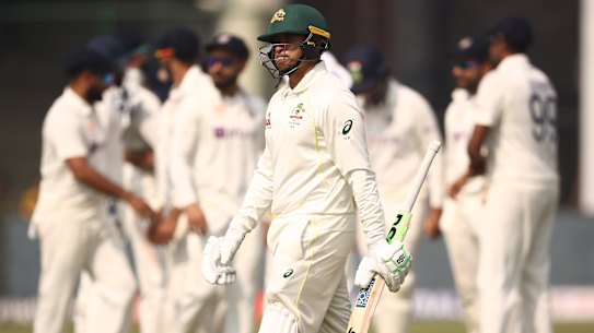 Usman Khawaja walks off after he was dismissed by Ravindra Jadeja in Delhi.