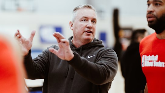 Chicago Bulls assistant coach Damien Cotter instructs players at the NBA Basketball Without Borders Asia camp.