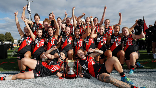 Essendon celebrate the VFLW premiership.