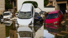 Flooded cars piled up are pictured in Valenci.