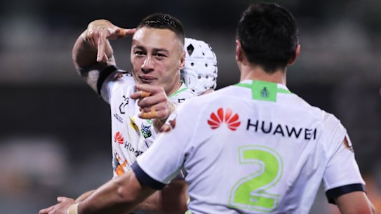 Canberra fullback Charnze Nicoll-Klokstad celebrates scoring a try during round 14 of the NRL. 