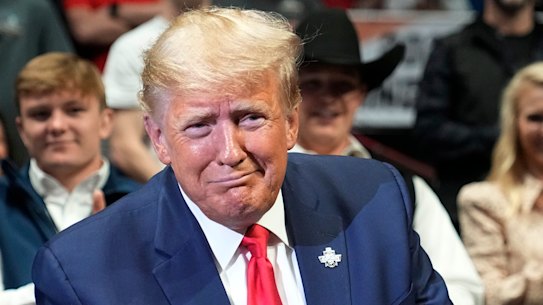 Putting up a fight: Former US president Donald Trump at the NCAA Wrestling Championships,  in Tulsa, Oklahoma on the weekend.