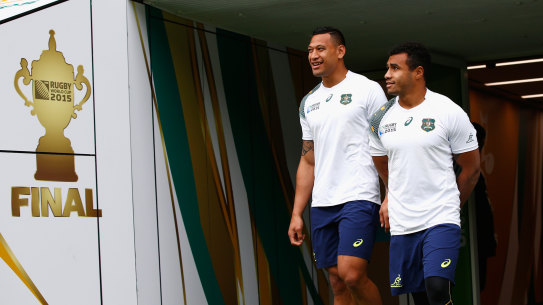 LONDON, ENGLAND - OCTOBER 30:  Australia players Will Genia (r) and Israel Folau share a joke as they make their onto the field during the Australia Captain’s Run ahead of the World Cup Final at Twickenham on October 30, 2015 in London, United Kingdom.  (Photo by Stu Forster/Getty Images) ...