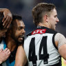 Zak Butters (left) and Willie Rioli of the Power celebrate.